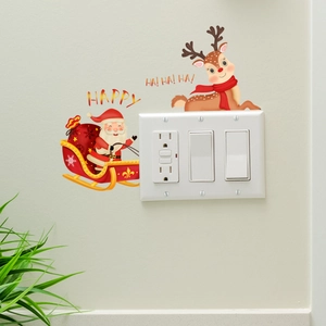 Luminous Christmas Santa and reindeer wall sticker detail on a light switch panel