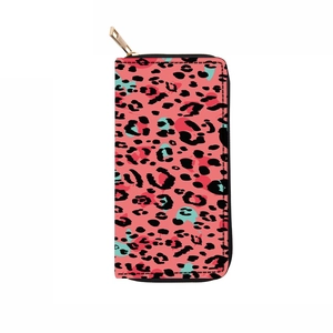 Detailed close-up of long PU wallet with pink leopard pattern and golden zipper teeth