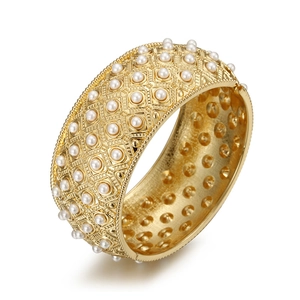Golden wide open cuff bracelet with white faux pearls in vintage hollow geometric pattern