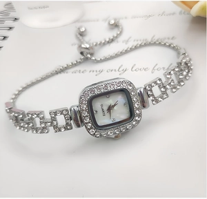 Detail of silver square diamond watch with adjustable pull-string bracelet strap