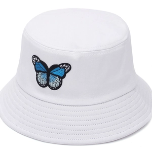 White cotton sun hat with blue butterfly embroidery on a clean background