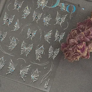 Detailed view of silver butterfly nail art stickers with crystal accents and laser finish