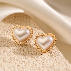 Elegant 18K gold heart pearl stud earrings with vintage beaded edge on silk