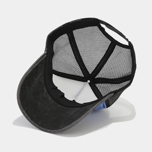 Distressed wash trucker hat with mesh back and adjustable strap for outdoor fashion
