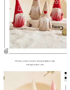Close-up of wooden Christmas gnome ornaments with felt hats and white beards on snow