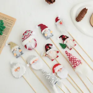 Set of 10 festive Christmas gnome cake toppers made of felt and wood for holiday DIY decor