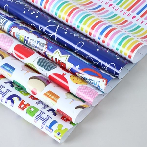 Birthday wrapping paper set with rainbow stripes, cupcakes and cartoon monster patterns