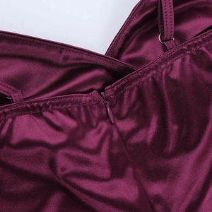 Close-up of adjustable spaghetti straps and invisible back zipper on satin dress
