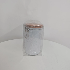 Close-up of white coffee storage canister with wooden lid and secure metal clasp seal