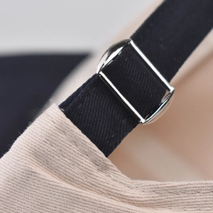Detail of adjustable metal buckle and navy twill fabric on cherry embroidered baseball cap