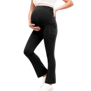 Detail view of maternity yoga pants with high waist support and side pockets in black
