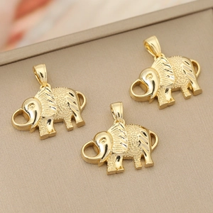 Detailed view of three 18K gold-plated elephant pendants with textured metallic finish