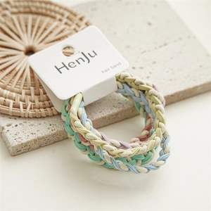 Close-up of pastel braided elastic hair bands displayed on a white product card.