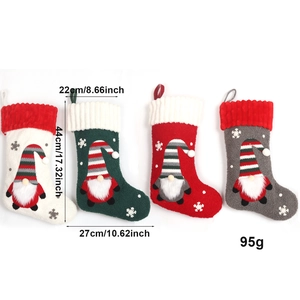Set of four plush Christmas stockings with gnome embroidery and knit cuffs for decor