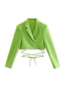 Detail of fruit green cropped blazer featuring waist wrap ties and notched lapels