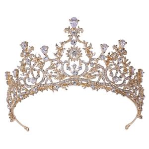 Macro detail of luxury bridal tiara with gold finish and teardrop shaped AAA cubic zirconia