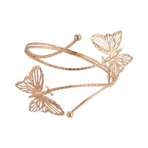Bracelet de bras papillon en or rose avec ailes ajourées et bande en métal spiralé