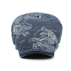 Vintage washed navy denim flat cap featuring white embroidered dragon patterns for men