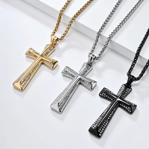 Hip hop gold, silver and black cross necklaces with diamonds on a textured platform