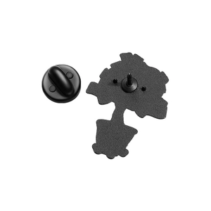 Detail view of the black alloy brooch back with rubber clutch and mounting pins