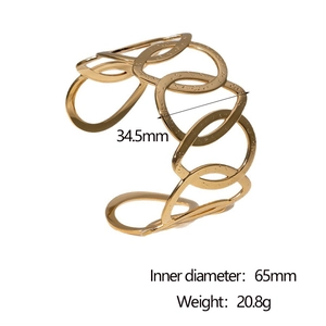 Detail view of 18k gold hollow cuff bracelet showing dimensions and 34.5mm width