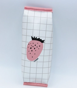 Detail of the pink strawberry print on a checkered PU leather stationery pencil case