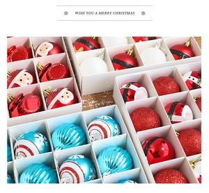 Close-up of colorful Christmas ornaments with Santa and snowflake patterns in a wooden box