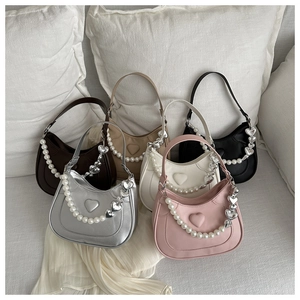 Collection of heart-embossed saddle bags in six colors with decorative pearl chains