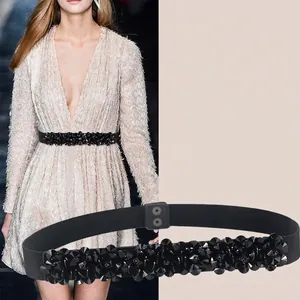 Women's elastic black waist belt featuring a decorative 3D floral crystal buckle