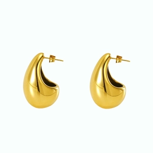 Detail of high-polish 18K gold-plated teardrop earrings with smooth mirror finish