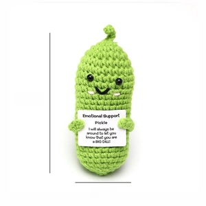 Detail showing height 12cm and width 5cm of hand-knitted green pickle emotion doll