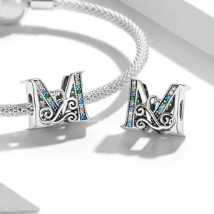 925 sterling silver letter M charm with colorful zircons on a mesh chain bracelet