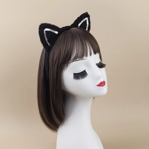 Cat ear headband with black faux fur and silver sequins shown on a mannequin head