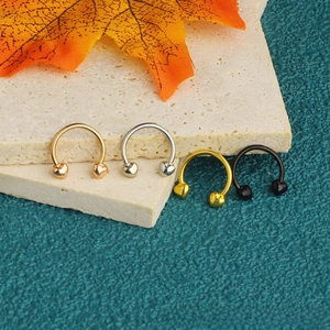Set of four stainless steel heart-shaped horseshoe rings in gold, silver, rose gold and black