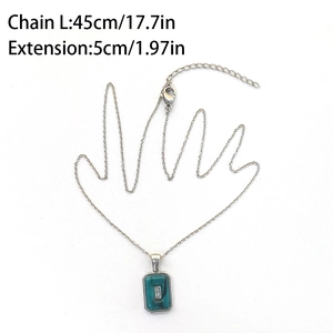Detail showing 45cm silver chain with green rectangle pendant and clear zircon inlay