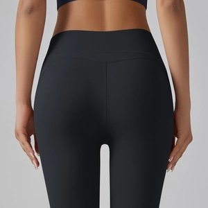 Detail view of the V-shaped back seam on high-waist black yoga leggings for butt lifting