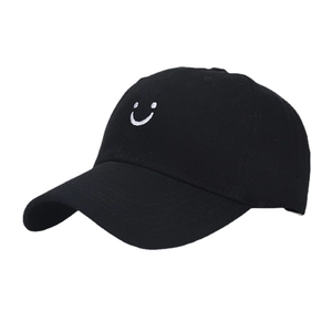 Classic black cotton baseball cap with minimalist white smile embroidery on the front
