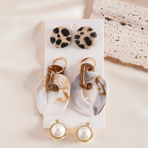 Three-pair earring set with leopard print, marble acrylic and pearls on white card