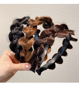 Detail of handcrafted fishtail braid headbands in black, light and dark brown hair colors