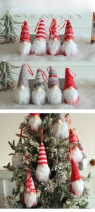 Knitted faceless Christmas gnomes with snowflake patterns hanging on a pine tree