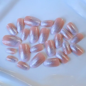 Pink peach glitter gradient almond press-on nails with shiny silver shimmer finish