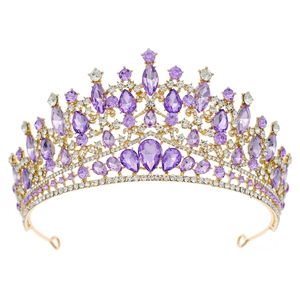 Detailed front view of gold bridal crown with purple gemstones and white rhinestones