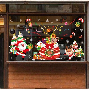 Detail of Christmas window stickers featuring Santa, snowman and elk on a glass storefront