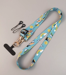 Close-up of light blue adjustable phone strap with sun and airplane totem patterns