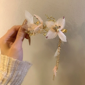 Pink fabric petal hair clip with pearls and golden long tassels with soft feathers