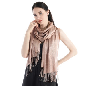 Close-up of rose gold sparkling pashmina scarf with elegant tassel fringe details