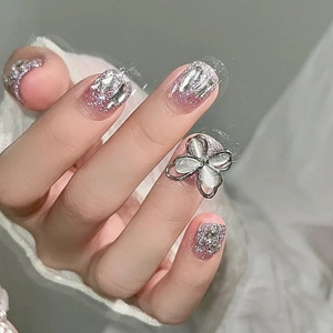 Pink gradient glitter press-on nails with 3D cat-eye butterfly and rhinestones