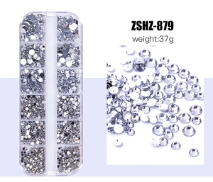 Macro view of 12-grid box with assorted flatback resin rhinestones for nail art DIY