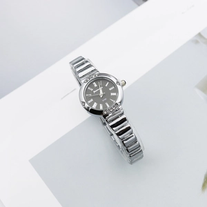 Elegant women's quartz watch with silver metal strap, Roman numerals and diamond bezel