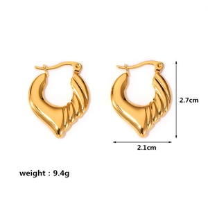 Close-up of gold twisted heart hoop earrings with dimensions 2.7cm height and 2.1cm width